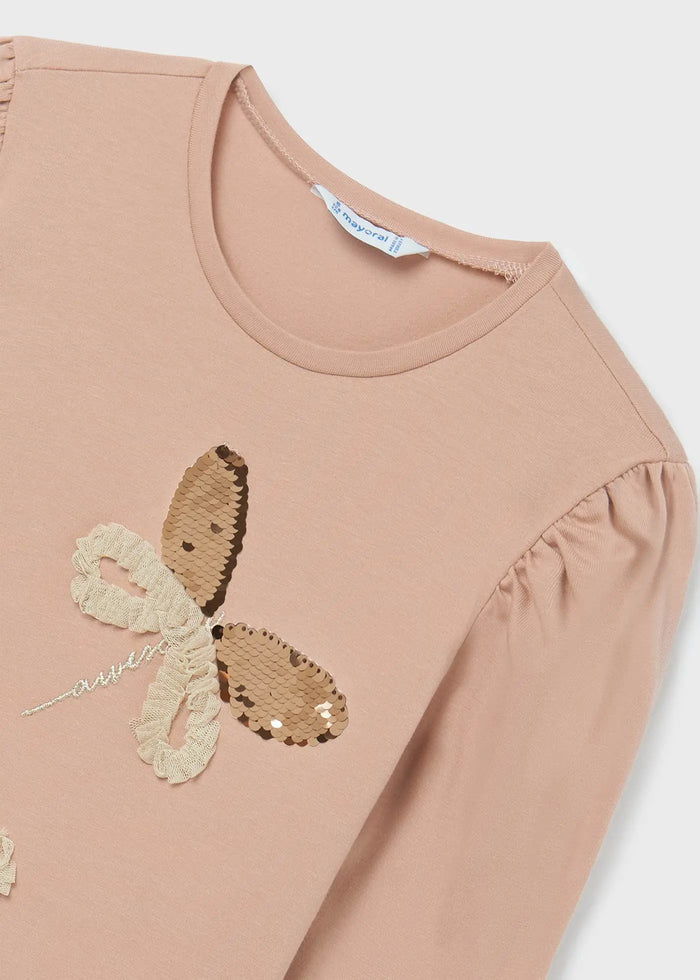 Closeup of Mayoral girls dragonfly T-shirt showing sequin details on Beige cotton fabric.