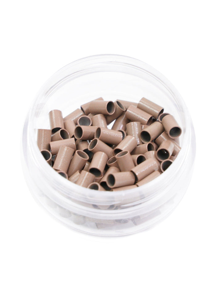 A clear plastic container of Perfect Locks Microlink Copper Beads in medium brown, filled with small tubes, viewed from above.#color_medium-brown