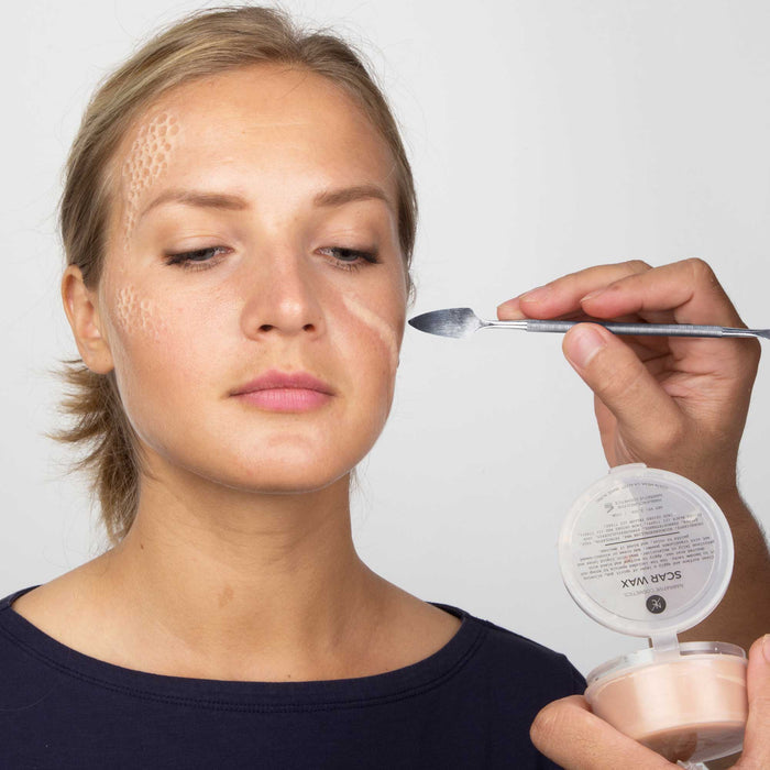 Model applying Scar Wax with metal spatula from Starter Effects Kit