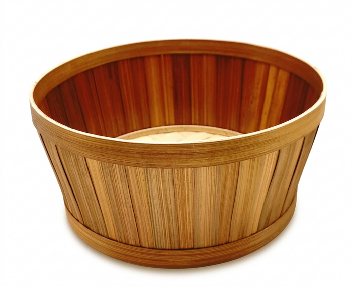 Wooden basket with a striped pattern on a white background