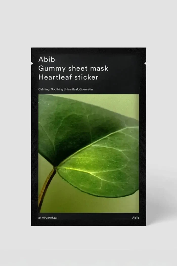 Front view of Abib Gummy Sheet Mask Heartleaf Sticker pack with green leaf artwork and “calming, soothing” text, soothing mask for sensitive skin