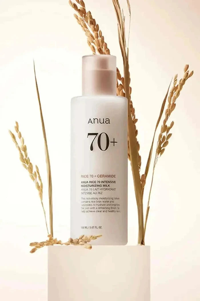 Anua Rice 70 Intensive Moisturizing Milk bottle styled with rice stalks, a non-sticky Lightweight Moisturizer for Oily Skin.