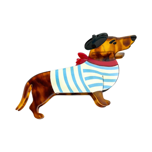 Blue acetate dachshund-shaped hair claw clip featuring a playful black beret detail.