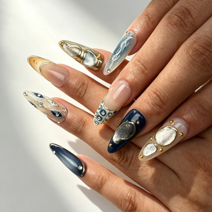 Close‑up handmade press‑on nails, sculpted gold‑metal rhombus rhinestone inlay glossy pearl manicure
