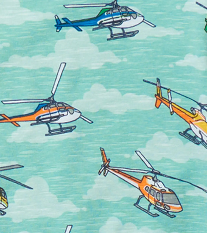 Closeup of Hatley boys helicopter pajama print on aqua cotton fabric with blue trim.