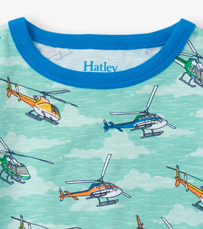 Closeup of Hatley boys pajama neckline with helicopter print, blue binding, and Hatley logo.