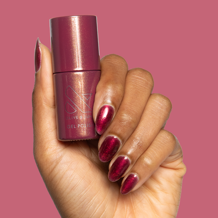 Budget? What Budget Gel deep rose-orange duochrome gel polish on almond-shaped nails for a polished mani by Olive and June