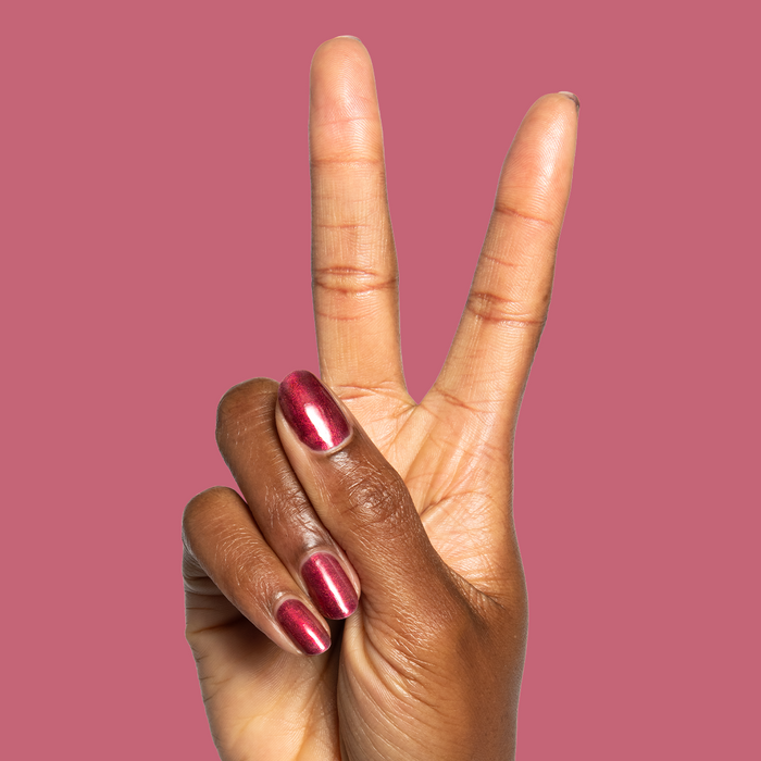Budget? What Budget Gel deep rose-orange duochrome gel polish on medium-length nails for a stylish mani by Olive and June
