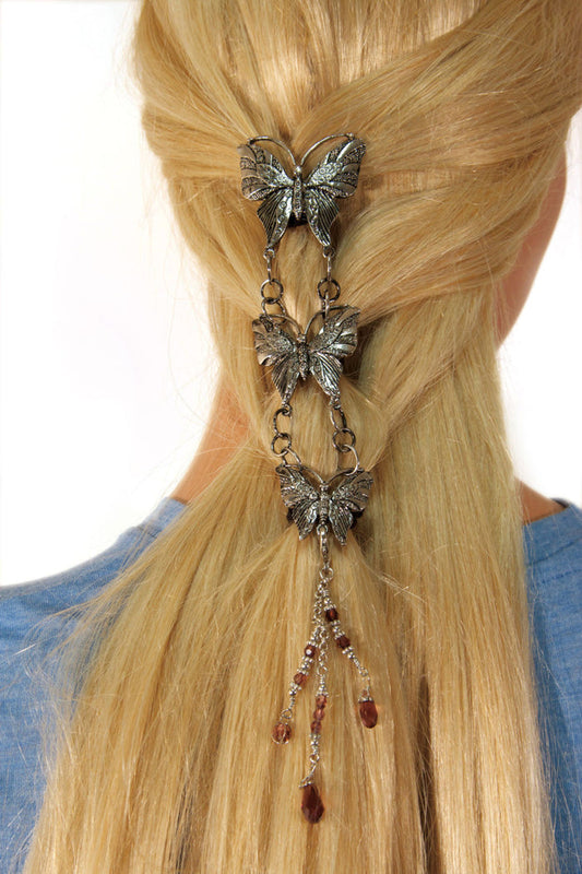 Silver butterfly hair hook with linked pendants, back view