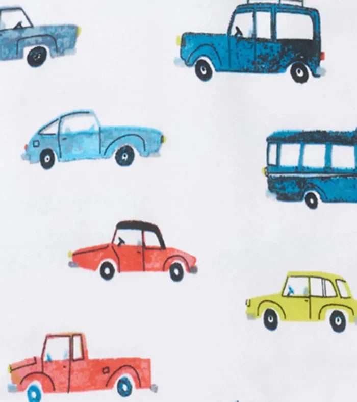 Closeup of Hatley Cars Raglan pajama print with cars on white organic cotton fabric.