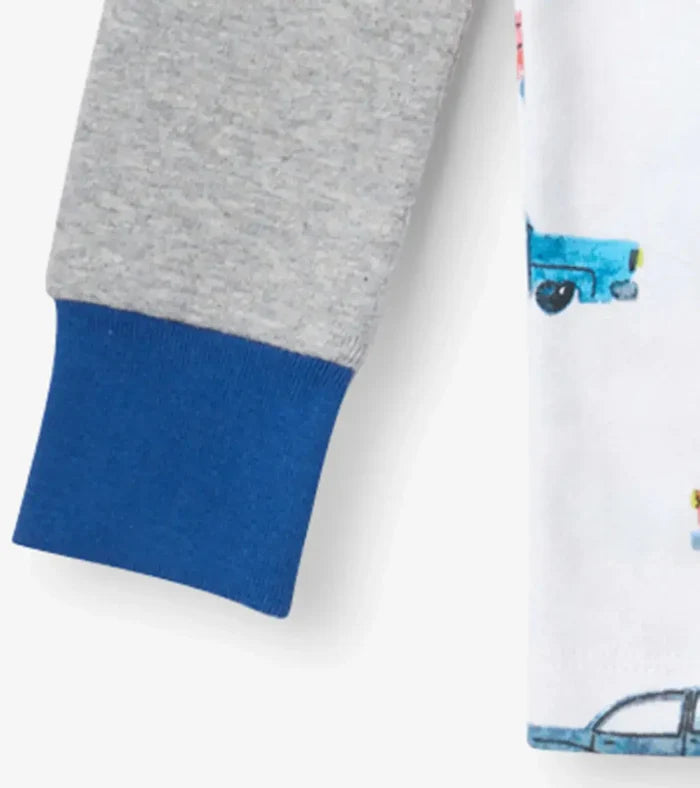 Closeup of Hatley boys pajama cuff with gray raglan sleeve, navy trim, and OCS organic cotton.
