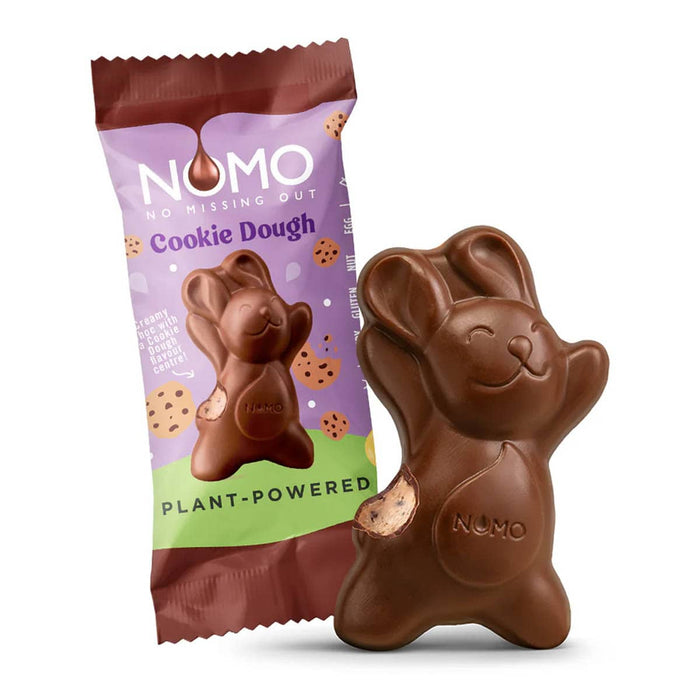 Nomo Cookie Dough vegan chocolate bar packaging with the chocolate bunny next to it with a bite taken out.