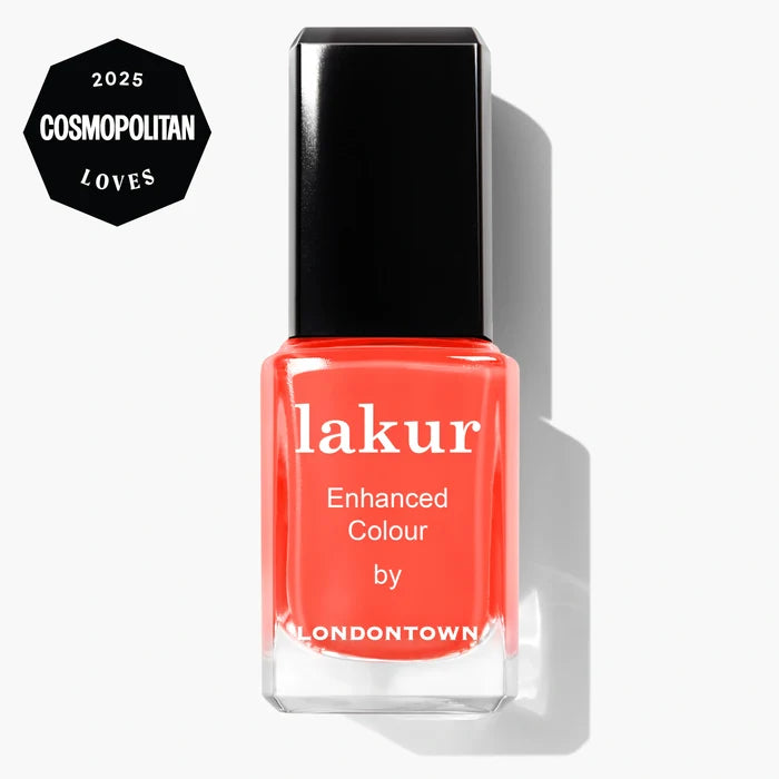 A bottle of LONDONTOWN lakur vegan nail polish in the shade "Flashback" is shown beside a “2025 Cosmopolitan Loves” badge on a white background.