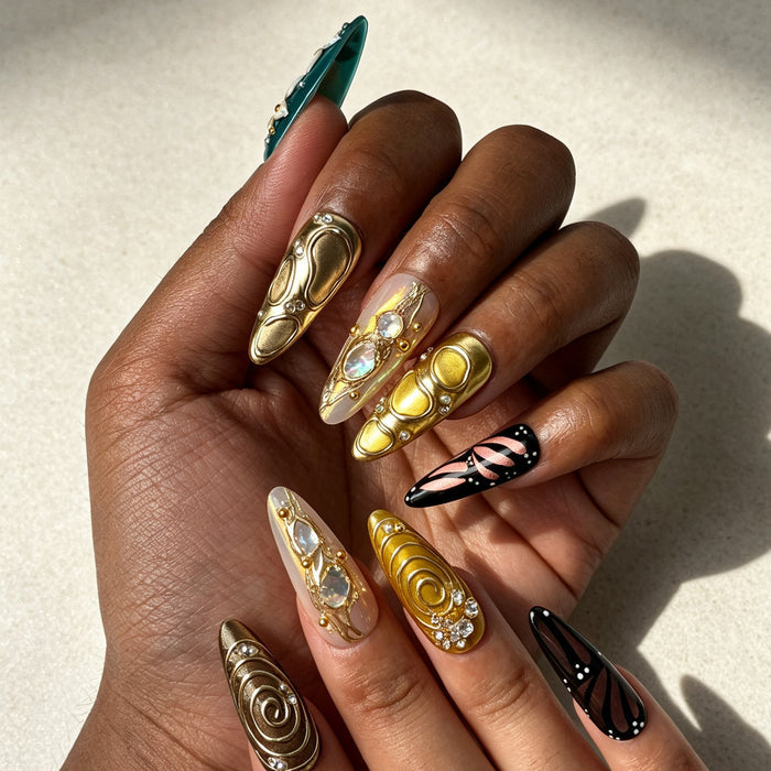 Close‑up handmade press‑on nails, sculpted 3D flower metallic‑gold‑swirl iridescent shell inlay manicure