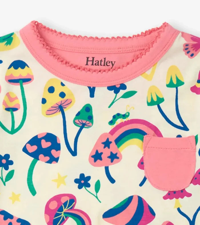 Closeup of Hatley girls Groovy Mushroom pajama top showing pink neckline, pocket, and bamboo fabric.