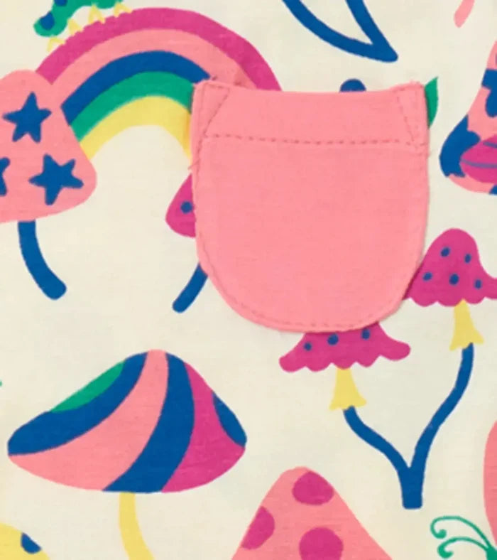 Closeup of Hatley girls mushroom pajama print with rainbows, flowers, and colorful artwork.