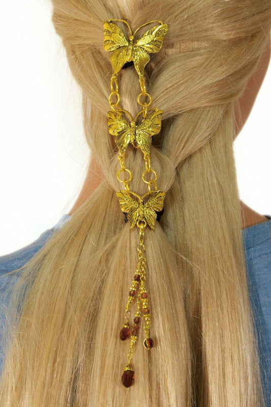 Gold butterfly hair hook with linked chain pendants worn in hair, back view