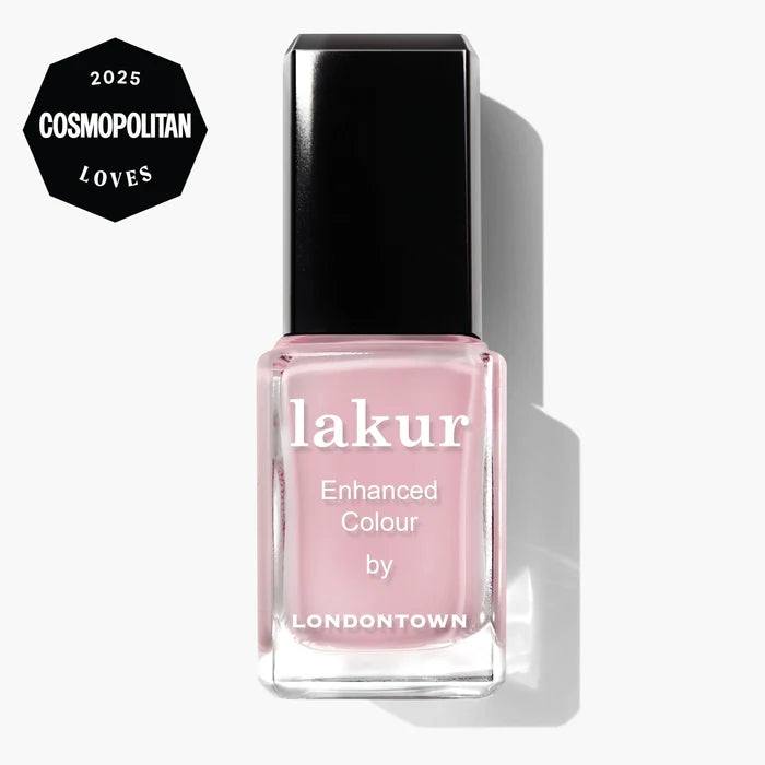 A bottle of LONDONTOWN Magnolia Haze lakur Enhanced Colour nail polish in sheer petal pink, featuring a 2025 Cosmopolitan Loves award badge in the top left corner.