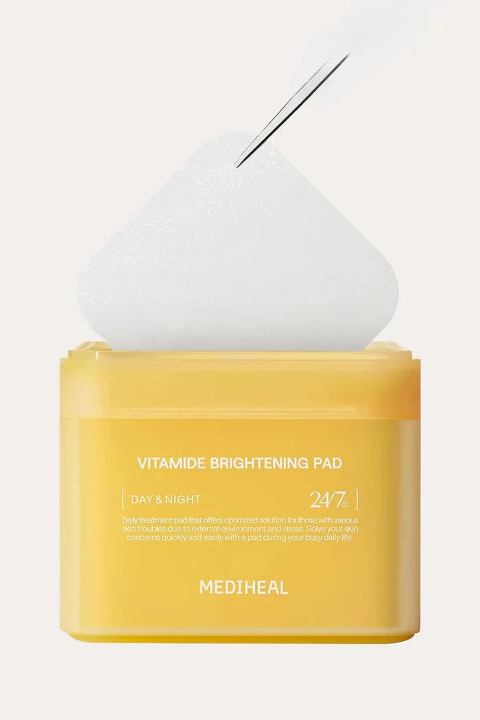 Mediheal Vitamide Brightening Pad container (100 sheets), featuring high-performance toner pads designed as essential skincare for dull skin.
