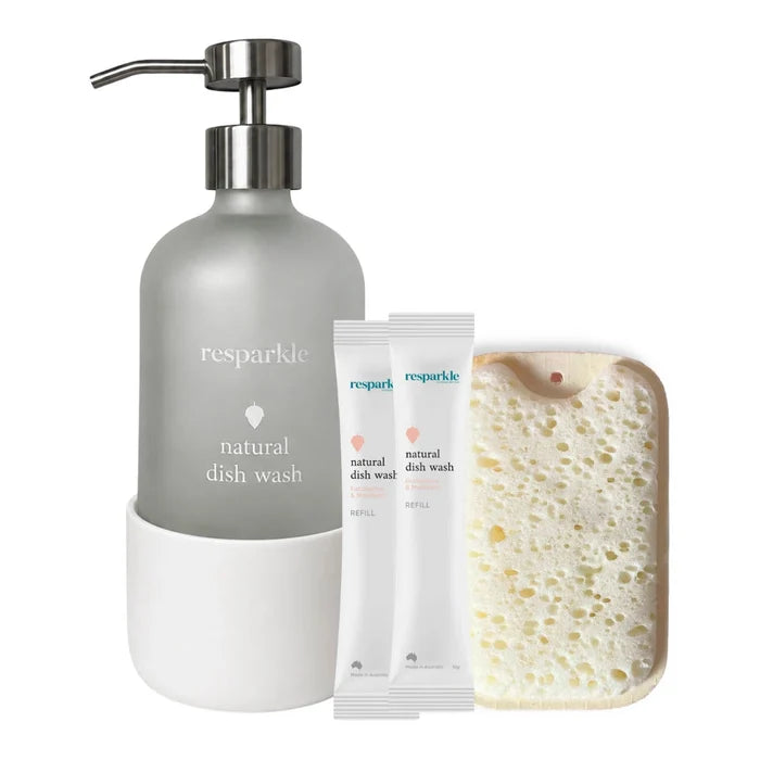 Resparkle natural dish wash set with dispenser, 2 refill sachets, and a sponge on a white background