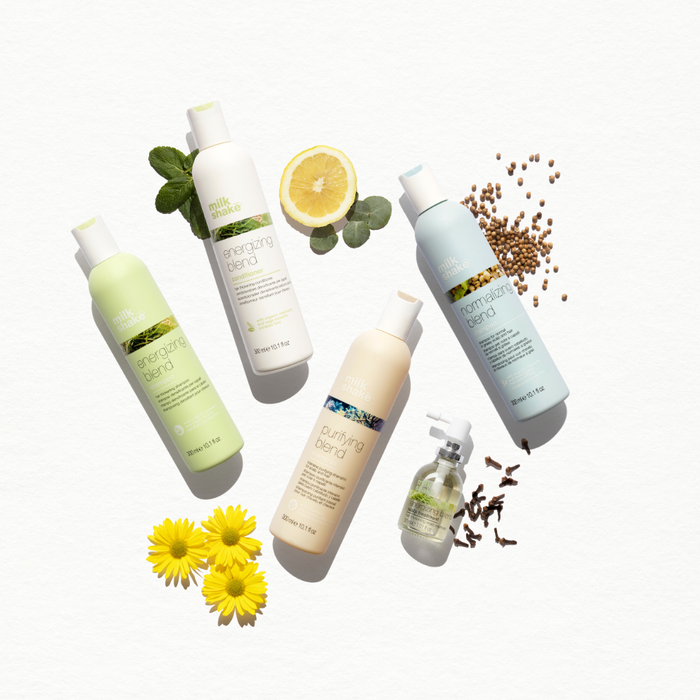 Collection of milk_shake products with flowers and leaves on a white background