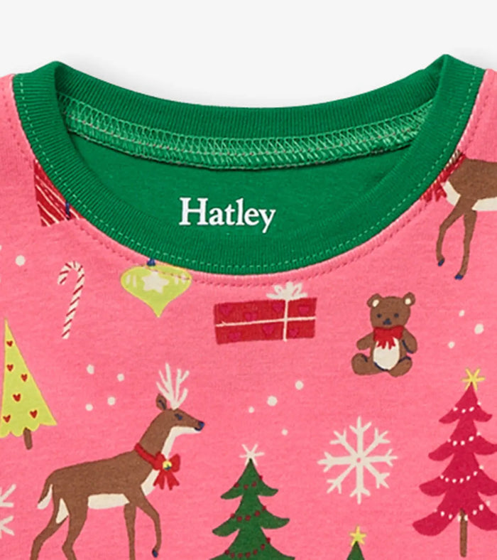 Closeup of Hatley girls Pink Christmas pajama top showing green neckline and holiday print.