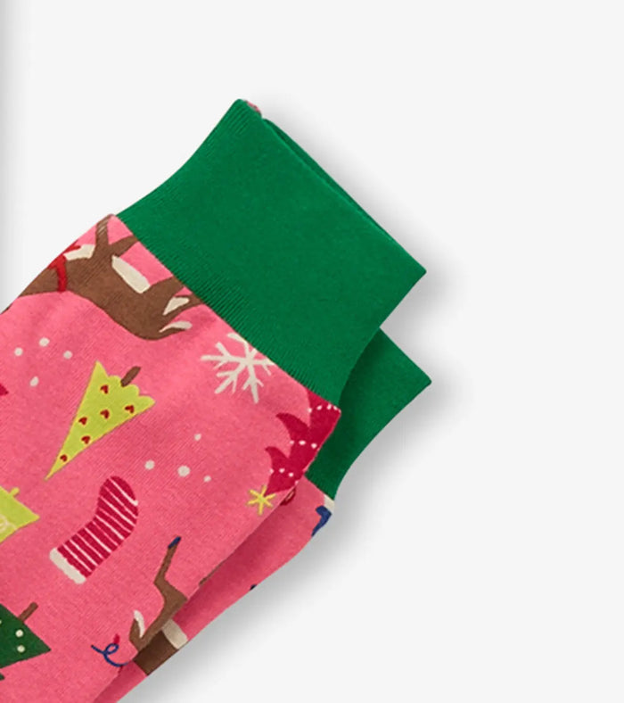 Closeup of Hatley girls organic cotton pajama cuff with green trim and Pink Christmas print.