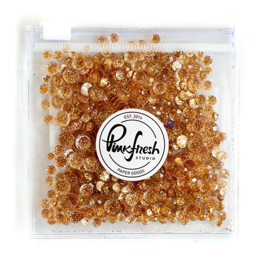Pinkfresh - Glitter Drops Essentials. Perfect for adding glitzy accents to your crafting projects! Contains 1 pack of glitter embellishment drops in mixed sizes (3mm/4mm/5mm/6mm). Available in a variety of colors: each sold separately. Available at Embellish Away located in Bowmanville Ontario Canada. Gold.