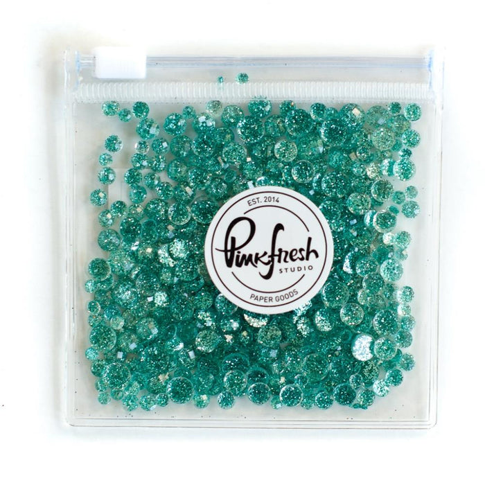 Pinkfresh - Glitter Drops Essentials. Perfect for adding glitzy accents to your crafting projects! Contains 1 pack of glitter embellishment drops in mixed sizes (3mm/4mm/5mm/6mm). Available in a variety of colors: each sold separately. Available at Embellish Away located in Bowmanville Ontario Canada. Aqua.