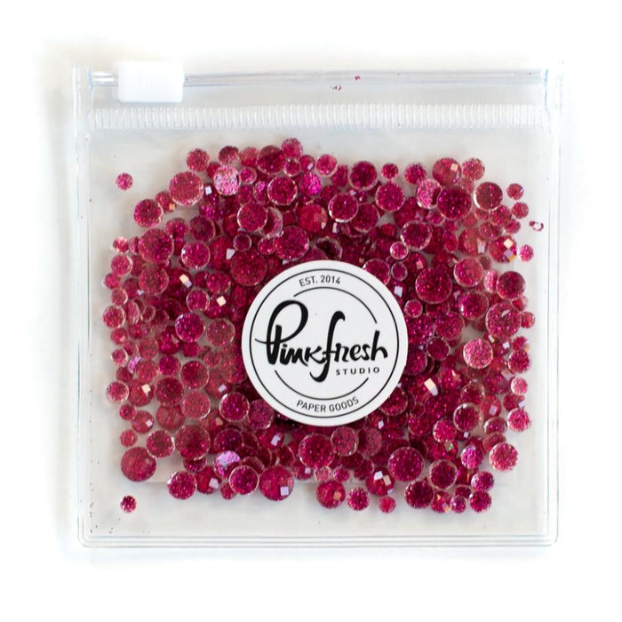 Pinkfresh - Glitter Drops Essentials. Perfect for adding glitzy accents to your crafting projects! Contains 1 pack of glitter embellishment drops in mixed sizes (3mm/4mm/5mm/6mm). Available in a variety of colors: each sold separately. Available at Embellish Away located in Bowmanville Ontario Canada. magenta.