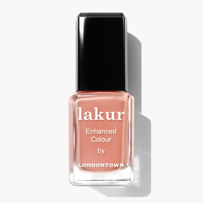 Bottle of Savanna by LONDONTOWN nail polish in a muted peachy nude shade with a black cap.