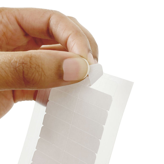 A person holding a white label, showcasing Perfect Locks Single Sided Replacement Tape (10 Pack Bundle).