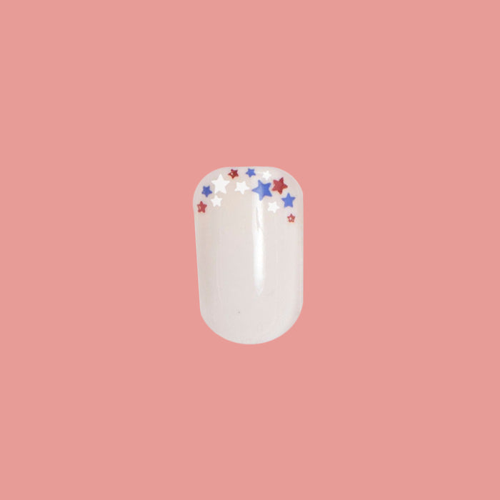 Star Showers | Squoval | Extra Short press-on manicure with extra short squoval shape and festive star French tip design