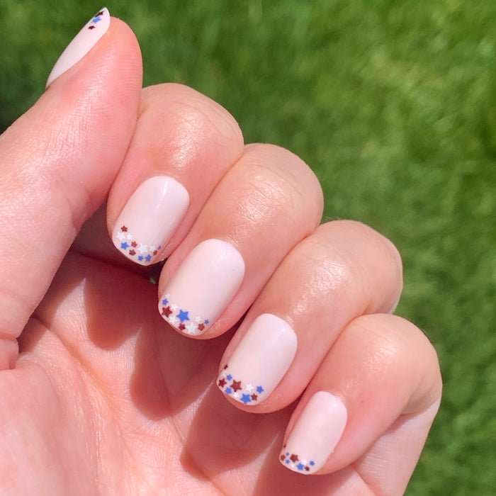 Star Showers | Squoval | Extra Short press-on manicure with festive tiny star French tips on extra short squoval nails