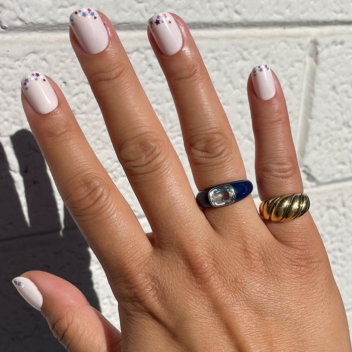 Star Showers | Squoval | Extra Short press-on manicure with tiny festive star French tips on extra short squoval nails