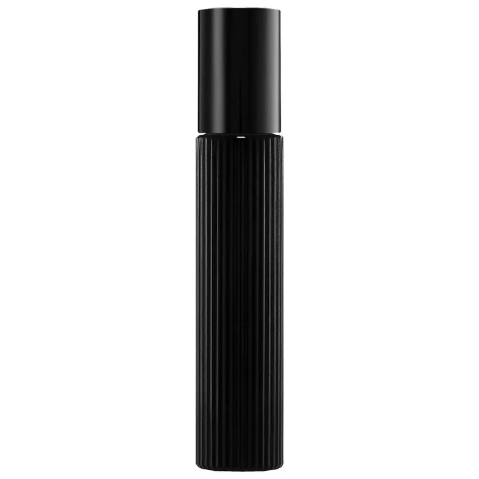 Tom Ford Black Orchid Eau de Parfum travel spray with black truffle and ylang ylang, featuring sleek black packaging and floral accents.