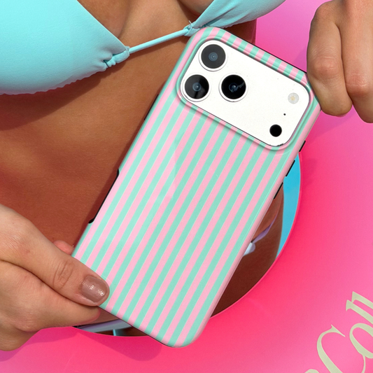 Girl holding a phone with a pink and green striped case, wearing a light blue bikini.