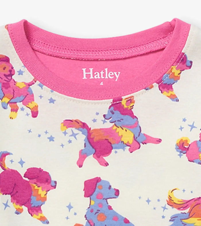 Closeup of Hatley girls Twinkle Puppies print with colorful puppies on white organic cotton pajamas.