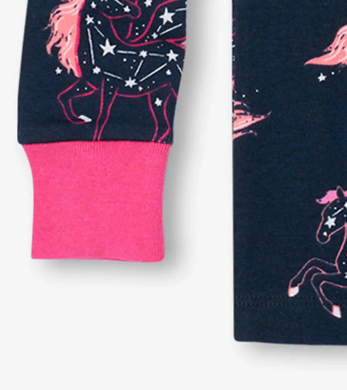 Closeup of Hatley girls pajama cuff with pink trim and Unicorn Constellations organic cotton fabric.