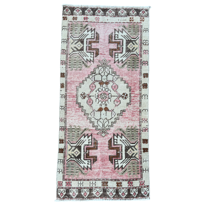 Vintage-style rug with geometric pattern on a white background